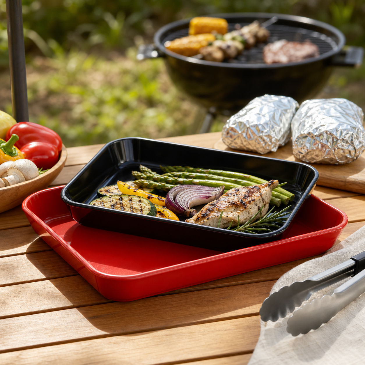 Cuisinart grilling trays arranged in a clean camp kitchen setup